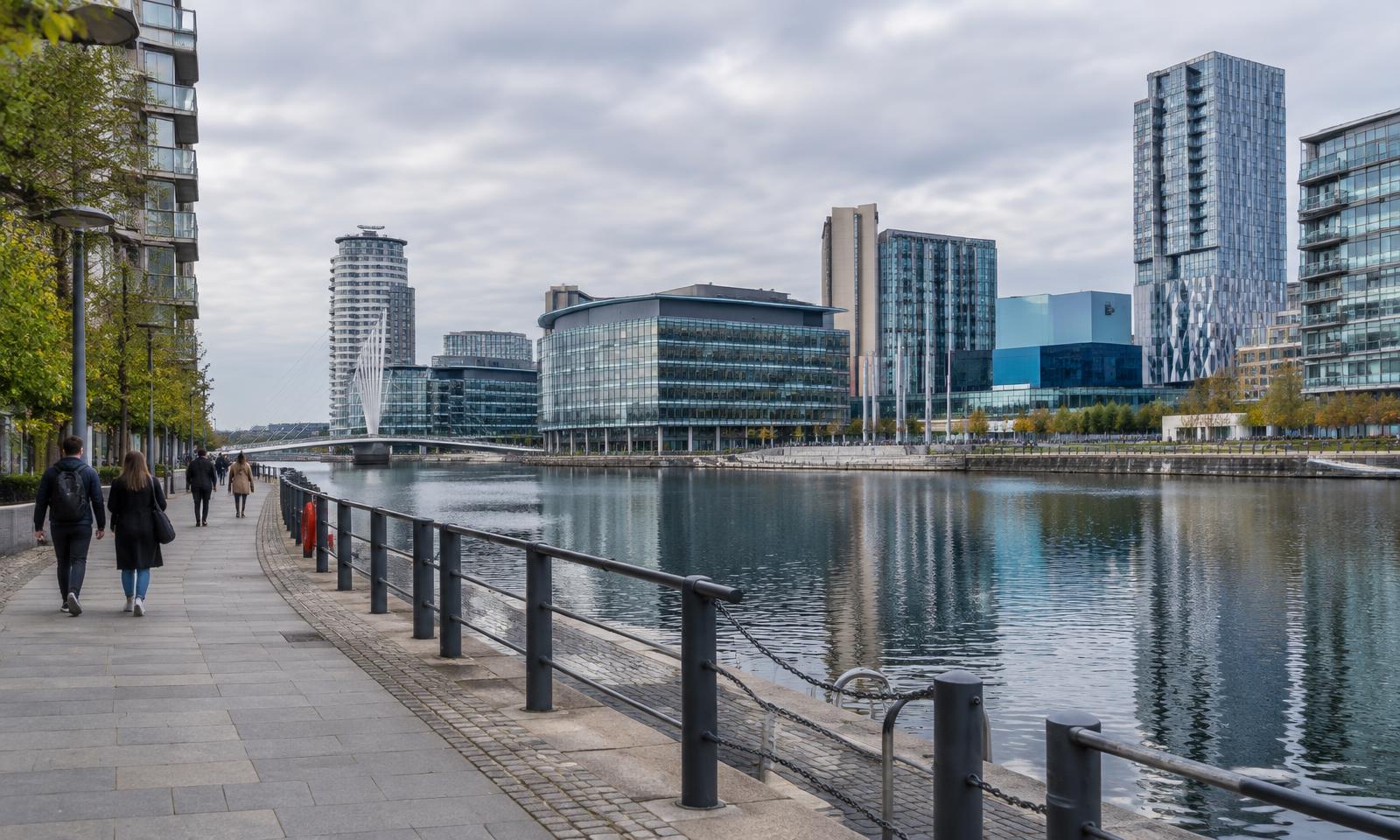 Illustrative editorial waterside scene inspired by Salford Quays